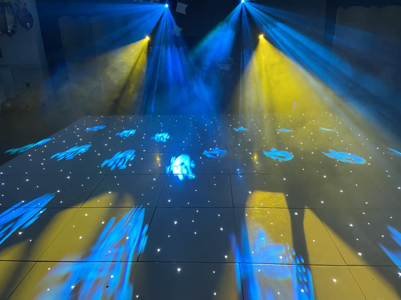 Party crowd on a lit dancefloor