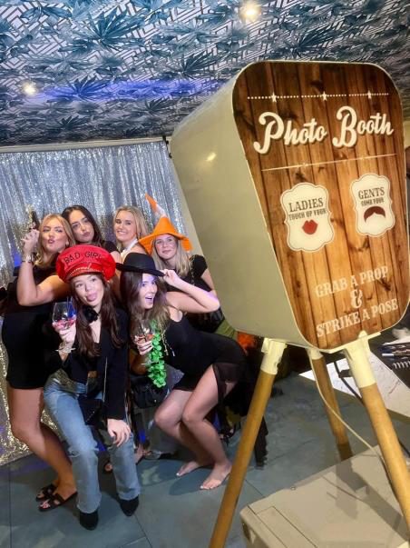 Guests posing in a photo booth